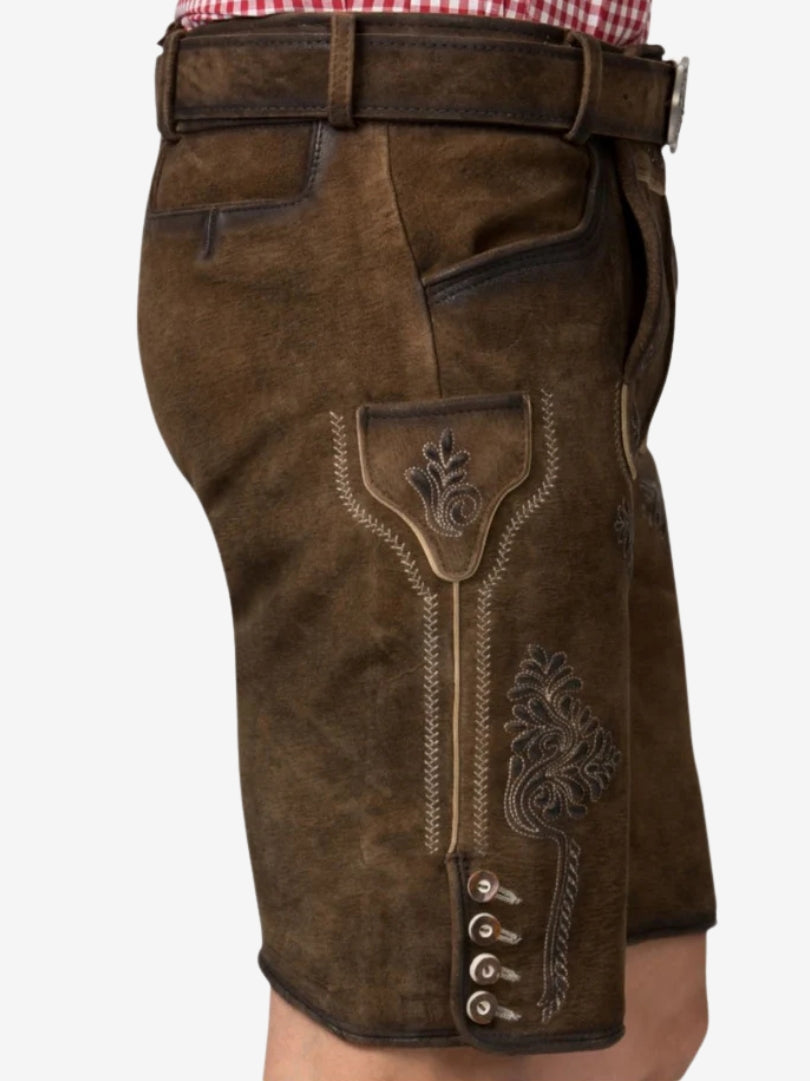Side view of brown lederhosen highlighting pocket flap, stitching, and decorative buttons.