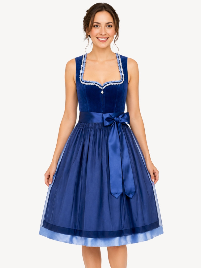 Premium navy blue Oktoberfest dirndl dress with velvet bodice, satin waist bow, decorative trim, and sheer layered skirt.