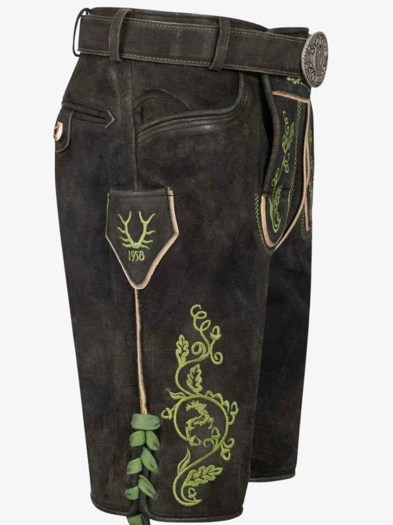 Detailed side view of black lederhosen showing embroidered motif, lace fastening, and small side pocket with stitched design.