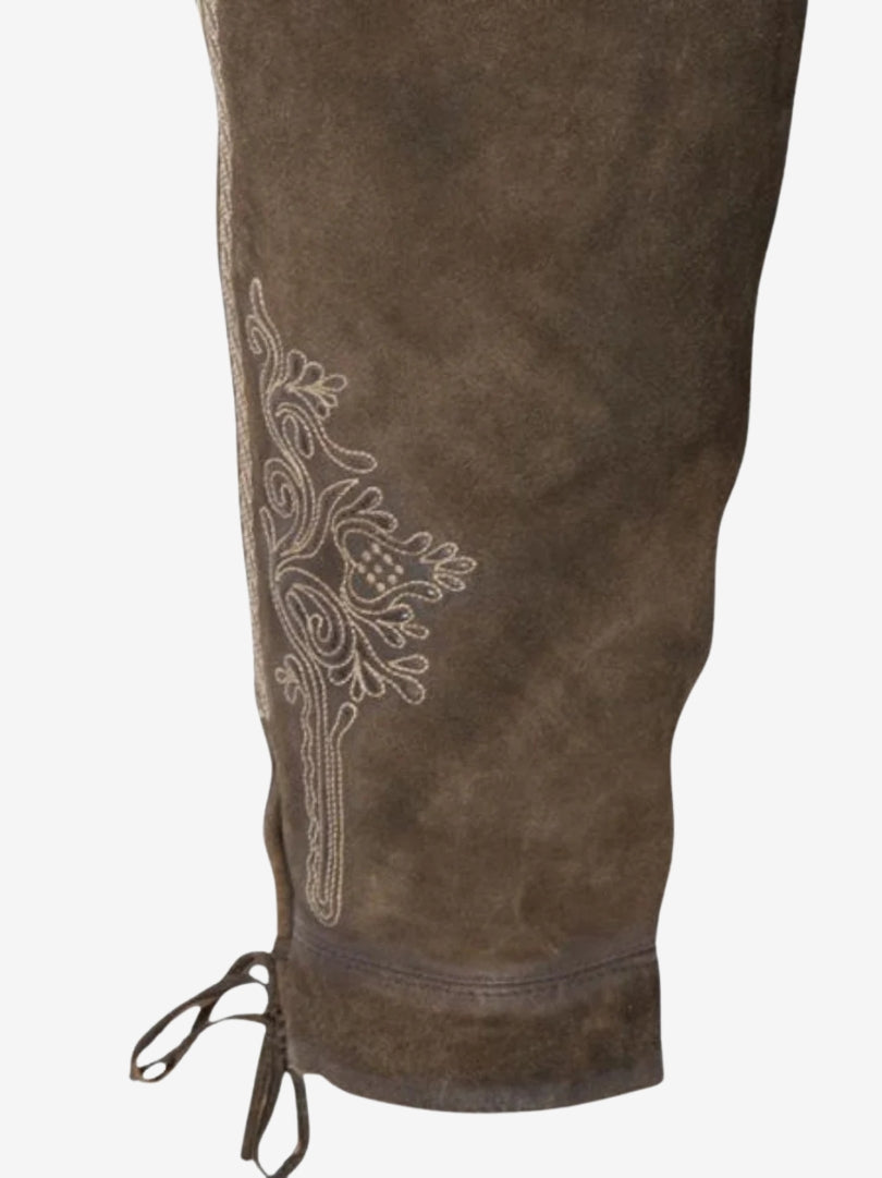 Side view of bundhosen highlighting embroidered pattern on the thigh and lace-up tie at the knee.