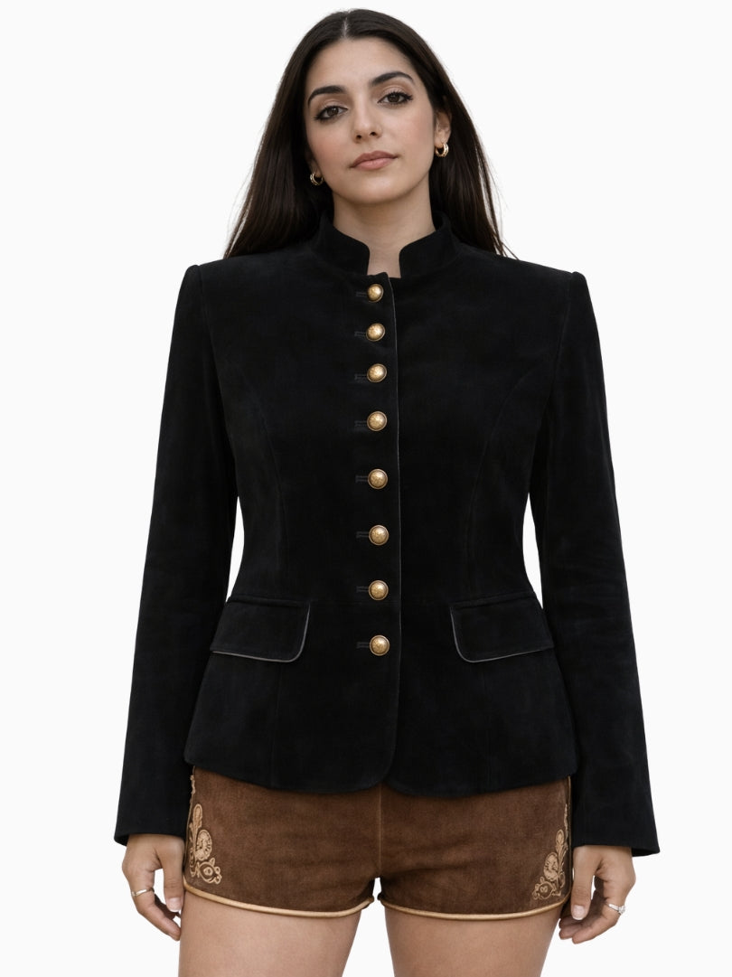 Womens black velvet Bavarian Trachten jacket with gold buttons and stand collar, traditional Oktoberfest alpine style paired with brown lederhosen shorts, front view
