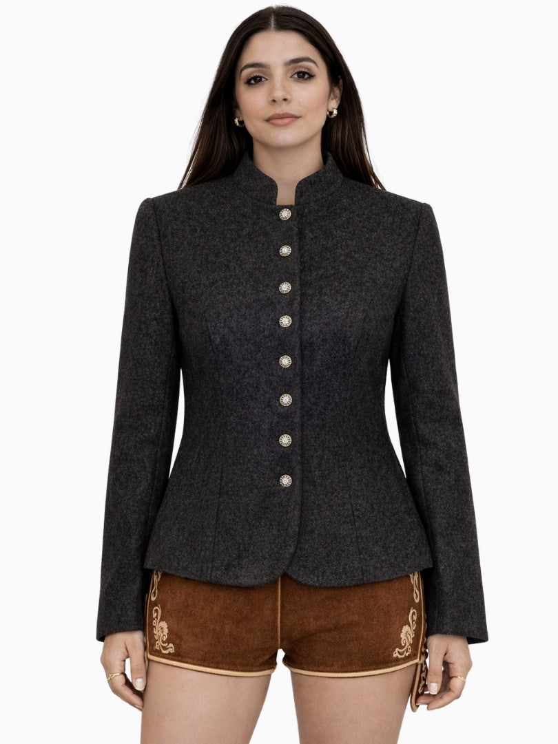 Front view of women's charcoal Bavarian Trachten jacket with decorative metal buttons, fitted waist, and classic Alpine styling worn with embroidered brown lederhosen shorts