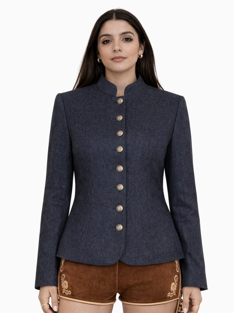 Front view of women’s navy blue Bavarian Trachten jacket featuring decorative metal buttons, fitted waist, and classic Alpine heritage style worn with embroidered lederhosen shorts.