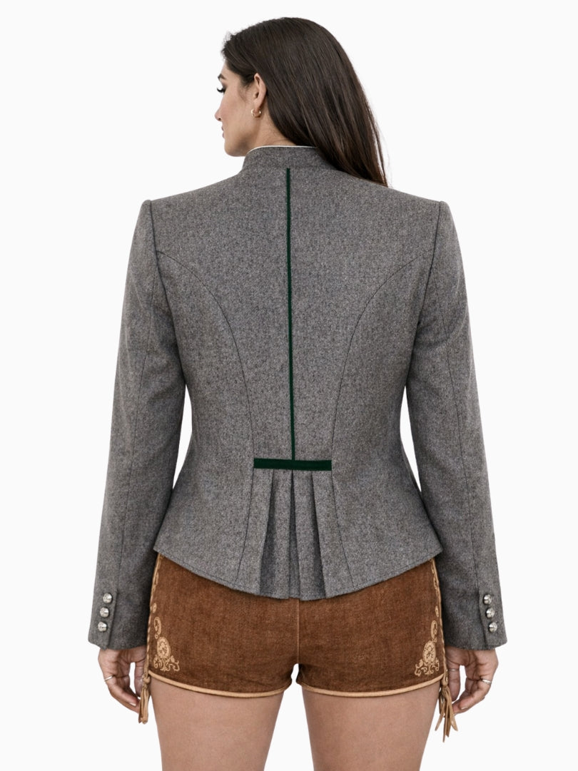 Womens grey Bavarian Trachten jacket with green trim, stand collar, silver buttons, tailored fit, and decorative brown leather shorts, front view.