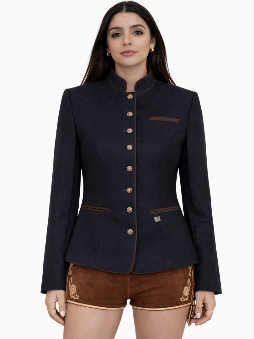 Front view of women's navy blue Bavarian Trachten jacket featuring traditional metal buttons, stand collar, tailored silhouette, and classic alpine heritage design with brown lederhosen shorts.