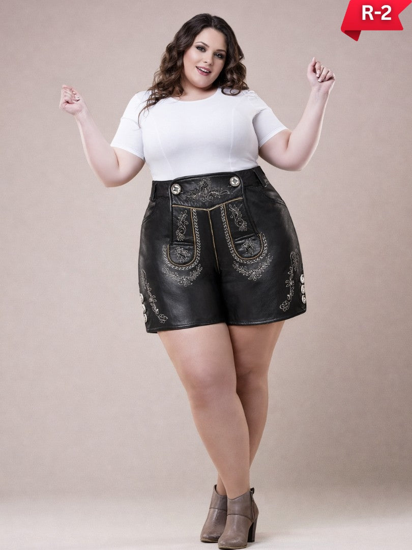 Plus size women wearing traditional Bavarian lederhosen in brown suede with embroidered suspenders, white blouse, and ankle boots, full-length studio image.